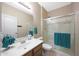 Bathroom with white sink vanity, mirror and glass shower stall at 13295 N 153Rd Ln, Surprise, AZ 85379
