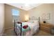 Cozy bedroom with natural light and neutral decor, complete with ceiling fan at 13295 N 153Rd Ln, Surprise, AZ 85379