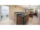 Open kitchen featuring a sink with dark countertops that overlooks a dining area and living space at 13295 N 153Rd Ln, Surprise, AZ 85379