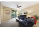 Comfortable living room with a ceiling fan, and sliding glass doors at 13295 N 153Rd Ln, Surprise, AZ 85379