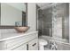 The stylish bathroom features marble counters, custom cabinets and a walk-in shower at 1356 S Mosley Ct, Chandler, AZ 85286
