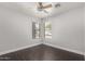 A well-lit room with a ceiling fan and windows dressed with horizontal blinds at 1356 S Mosley Ct, Chandler, AZ 85286