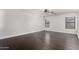 Bright bedroom with hardwood flooring, a ceiling fan, and a modern paint scheme at 1356 S Mosley Ct, Chandler, AZ 85286