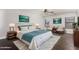 Serene bedroom with neutral tones, light colored walls, ceiling fan and modern furnishings; a perfect retreat at 1356 S Mosley Ct, Chandler, AZ 85286
