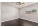 Cozy bedroom with ceiling fan, window providing lots of natural light at 1356 S Mosley Ct, Chandler, AZ 85286