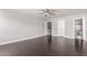 Bright main bedroom with hardwood flooring, a ceiling fan, and an attached bath at 1356 S Mosley Ct, Chandler, AZ 85286
