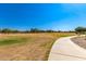 Community park with a walking path, open green space, and scattered trees at 1356 S Mosley Ct, Chandler, AZ 85286