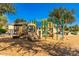 Community playground featuring slides, climbing structures, and a soft wood chip ground at 1356 S Mosley Ct, Chandler, AZ 85286