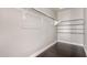 This spacious walk-in closet features ample hanging space and shelving for storage at 1356 S Mosley Ct, Chandler, AZ 85286