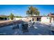 Relaxing backyard with Adirondack chairs around a fire pit, perfect for gatherings and enjoying the outdoors at 13620 N 80Th Pl, Scottsdale, AZ 85260