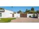 Gated backyard area featuring an artificial putting green, providing a fun recreational space at 13620 N 80Th Pl, Scottsdale, AZ 85260
