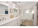 Bright bathroom with double vanity, soaking tub, walk-in shower, and modern fixtures at 13620 N 80Th Pl, Scottsdale, AZ 85260