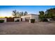 Home with an expansive brick driveway, a two car garage, privacy gate, and desert landscaping at 13620 N 80Th Pl, Scottsdale, AZ 85260