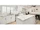 Bright kitchen featuring white cabinets, subway tile backsplash, and marble countertops with stainless steel appliances at 13620 N 80Th Pl, Scottsdale, AZ 85260