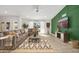 Bright living room features a large sectional sofa, decorative rug, and a wall-mounted TV at 13620 N 80Th Pl, Scottsdale, AZ 85260