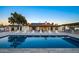 Inviting backyard pool with lounge chairs and an outdoor bar perfect for entertaining under the desert sky at 13620 N 80Th Pl, Scottsdale, AZ 85260