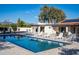 Sparkling backyard pool surrounded by lounge chairs, perfect for enjoying sunny days and mountain views at 13620 N 80Th Pl, Scottsdale, AZ 85260