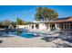Backyard pool with lounge chairs and lush landscaping creates a serene outdoor living space at 13620 N 80Th Pl, Scottsdale, AZ 85260