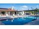 Backyard pool with an outdoor bar and multiple lounge chairs, ideal for relaxation and entertaining guests at 13620 N 80Th Pl, Scottsdale, AZ 85260
