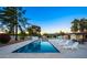 Swimming pool with lounge chairs and a dining area, showcasing the backyard at 13620 N 80Th Pl, Scottsdale, AZ 85260