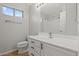 Bright bathroom featuring tile floors, framed mirror, and shower/tub combo at 1453 E South Fork Dr, Phoenix, AZ 85048