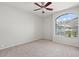 Bright bedroom with carpet, neutral paint and a large window with neighborhood views at 1453 E South Fork Dr, Phoenix, AZ 85048