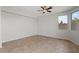 Empty bedroom with tile flooring, neutral paint, and natural light at 1453 E South Fork Dr, Phoenix, AZ 85048
