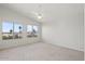 Bright bedroom with three large windows offering beautiful views of the neighborhood at 1453 E South Fork Dr, Phoenix, AZ 85048