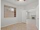 Bedroom with neutral tones, ceiling fan, and backyard view through a double window at 1453 E South Fork Dr, Phoenix, AZ 85048