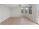 Bonus room with tile flooring, ceiling fan, and natural light at 1453 E South Fork Dr, Phoenix, AZ 85048