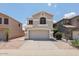 Charming two-story home featuring a neutral color palette, well-maintained landscaping and a two car garage at 1453 E South Fork Dr, Phoenix, AZ 85048