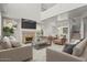 Bright living room featuring high ceilings, fireplace, and modern furnishings at 1453 E South Fork Dr, Phoenix, AZ 85048