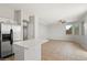 Open-concept layout with kitchen island flowing to an expansive living space with lots of natural light at 1453 E South Fork Dr, Phoenix, AZ 85048