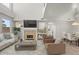 Inviting living room with a cozy fireplace, high ceilings, and contemporary decor, perfect for relaxation at 1453 E South Fork Dr, Phoenix, AZ 85048