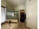 Bathroom featuring a glass enclosed shower, tub, toilet, and walk-in closet with built-in storage at 16242 S 12Th Pl, Phoenix, AZ 85048