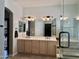 Bright bathroom with a double vanity sink, neutral-toned walls, and tiled flooring at 16242 S 12Th Pl, Phoenix, AZ 85048