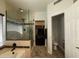 Bathroom with a glass enclosed shower, tub, toilet, and walk-in closet with built-in storage at 16242 S 12Th Pl, Phoenix, AZ 85048