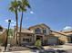 Charming two-story home featuring a tile roof, desert landscaping, and mature palm trees at 16242 S 12Th Pl, Phoenix, AZ 85048