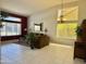 Spacious living area with large windows, stylish furnishings, and neutral tones, creating a warm and inviting atmosphere at 16242 S 12Th Pl, Phoenix, AZ 85048