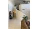 Spacious living area showcasing a striking curved staircase, soaring ceilings, and a neutral color palette at 16242 S 12Th Pl, Phoenix, AZ 85048