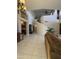 Expansive living area with a modern curved staircase, high ceilings, neutral walls and tile floors at 16242 S 12Th Pl, Phoenix, AZ 85048