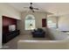 Carpeted loft area with a sofa, large window and a ceiling fan at 16242 S 12Th Pl, Phoenix, AZ 85048