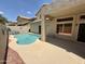 The backyard featuring a refreshing swimming pool, covered patio, and beautifully landscaped surroundings at 16242 S 12Th Pl, Phoenix, AZ 85048