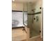 Modern tiled shower with glass enclosure and matte black fixtures, located next to a tub and window at 16242 S 12Th Pl, Phoenix, AZ 85048