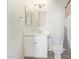 Clean bathroom with white cabinets, sink, mirror, and a toilet at 1701 E Colter St # 491, Phoenix, AZ 85016