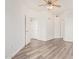 Bright bedroom featuring wood-look floors, ceiling fan, and neutral paint at 1701 E Colter St # 491, Phoenix, AZ 85016