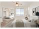 Bedroom featuring a bed, large closet mirror, and a window at 1701 E Colter St # 491, Phoenix, AZ 85016