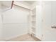 Walk-in closet with built in shelving and wood floors at 1701 E Colter St # 491, Phoenix, AZ 85016