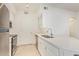 White kitchen boasts stainless steel appliances, ample counter space, and bright white cabinetry at 1701 E Colter St # 491, Phoenix, AZ 85016