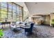 Inviting living room with comfortable seating, floor-to-ceiling windows, piano, and a bar at 1701 E Colter St # 491, Phoenix, AZ 85016